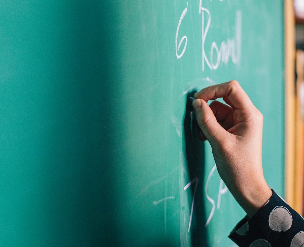 Hand writing on chalkboard